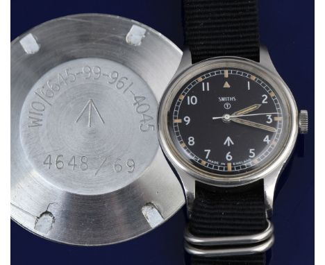 Smiths British military issue wristwatch with luminous hands and hour markers, Arabic numerals, black dial, stainless steel c