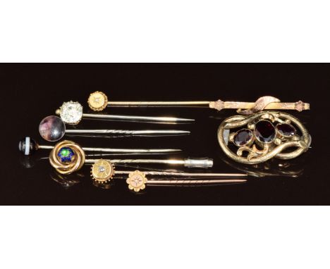 Seven Victorian stick pins including paste, banded agate, 9ct gold set with a diamond, 9ct gold set with a pearl, knot, etc, 