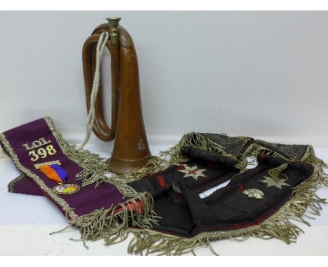 A bugle with Boys Brigade emblem, and two sashes, one with Masonic badges
