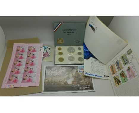 A set of 1969 French coins, Monnaie De Paris, a small collection of stamps and a 1972 Oliver's Mount International Road Races
