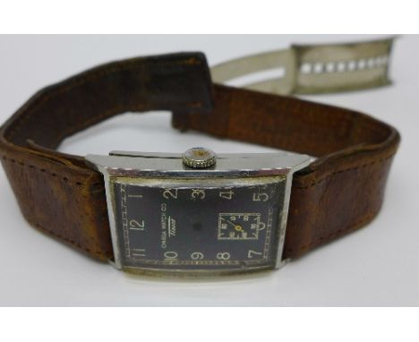 An Omega Watch Co., Tissot, wristwatch with black dial, hands loose