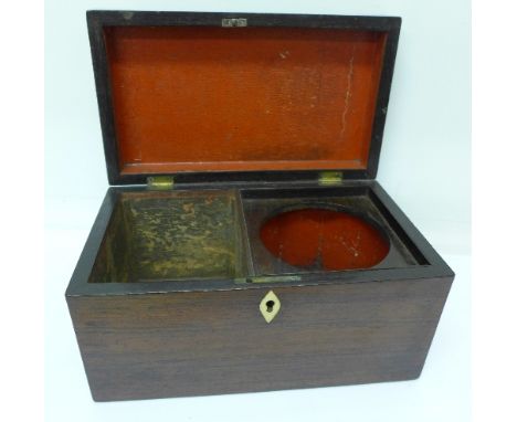 A rosewood tea caddy, lacking interior