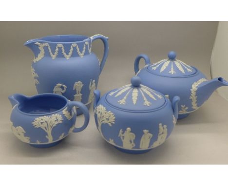 A Wedgwood Jasperware jug, teapot, creamer and sugar pot, knob on teapot a/f