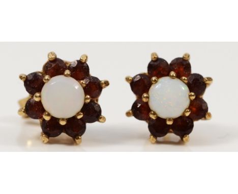 A pair of 9ct gold opal and garnet cluster earrings with scroll backs, 2.3g