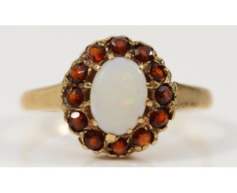 A 9ct gold garnet and opal cluster ring, Birmingham 1993, J, 1.8g