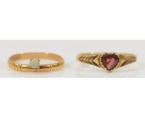 A 9ct gold opal solitaire ring, J, together with a 9ct gold garnet heart shaped ring, N, 2.3g