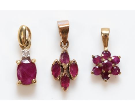 Three 9ct gold ruby and diamond pendants, 1.7g