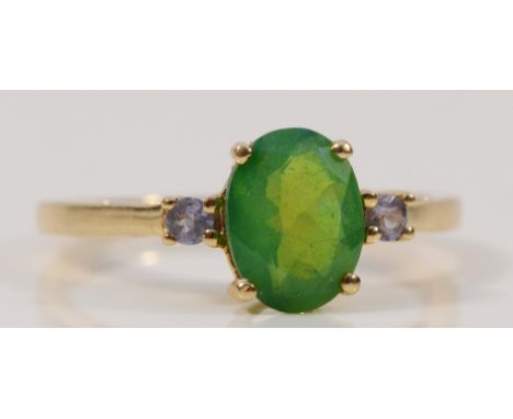 A 9ct gold enhanced opal solitaire ring with tanzanite set shoulders, L 1/2, 1.8g
