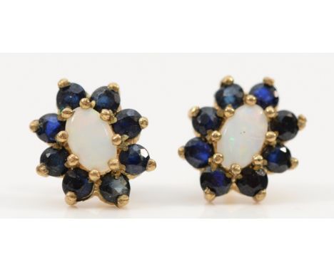 A pair of 9ct gold sapphire and opal cluster earrings with scroll backs, 1.1g
