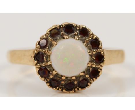 A 9ct gold opal and garnet cluster ring, J 1/2, 2.3g