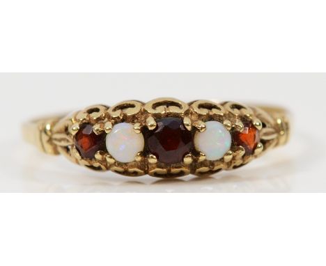 A 9ct gold opal and garnet five stone carved claw dress ring, O, 1.2g
