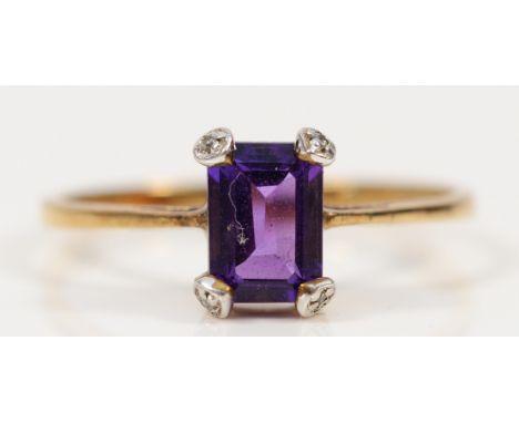 A 9ct gold amethyst solitaire ring with diamond tipped claws, P, 1.5g