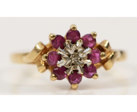 A 9ct gold ruby and diamond cluster ring, London 1979, N, 2.1g