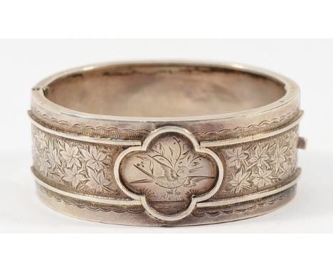 A Victorian sterling silver Aesthetic movement hinged bangle, 55mm, 31g Condition-Good condition, minor bruises to the back, 