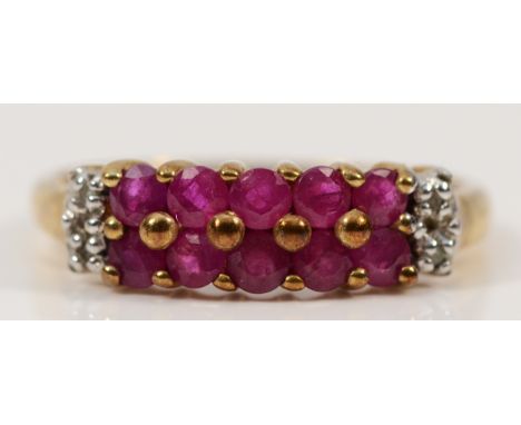 A 9ct gold ruby and diamond two row dress ring, P, 2.2g