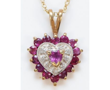 A 9ct gold ruby and diamond heart pendant with a chain, 2g