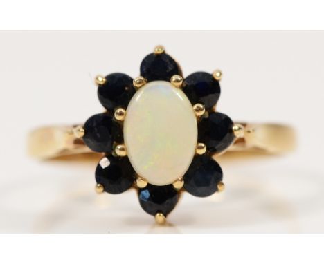 A 9ct gold opal and sapphire cluster ring, N, 2.2g