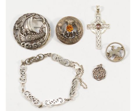 Two Scottish silver brooches, depicting a longboat and a thistle, a sterling silver bird brooch, two 925 silver Celtic design