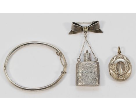 Charles Horner, a silver hinged engraved pattern bangle, 58mm, with an Edwardian silver and paste perfume bottle brooch, and 