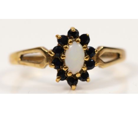 A 9ct gold opal and sapphire cluster ring, L 1/2, 1.6g
