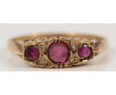 A 9ct gold diamond and ruby dress ring, O, 2.1g