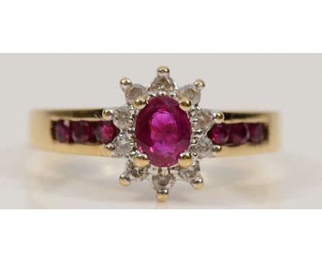 A 9ct gold ruby and brilliant cut diamond cluster ring, with ruby set shoulders, M, 2.4g