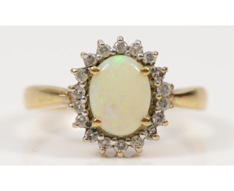 A 9ct gold diamond and opal cluster ring, R, 3.4g