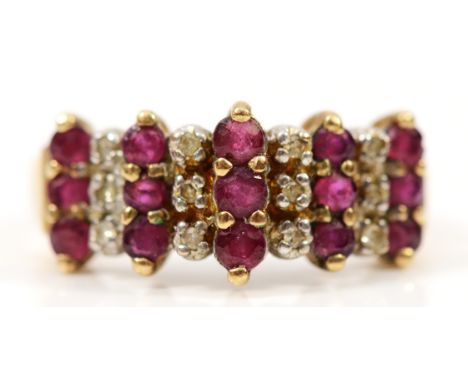 A 9ct gold ruby and diamond three row dress ring, I 1/2, 2.1g
