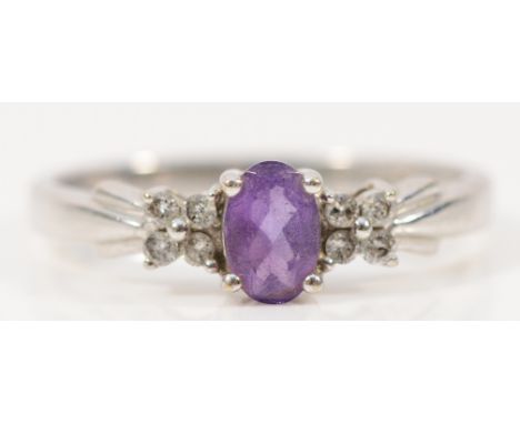 A 9ct white gold amethyst solitaire ring with diamond set shoulders, N, 1.9g