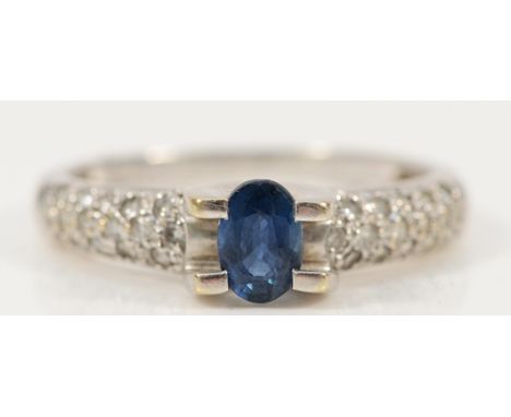 An 18ct white gold sapphire four claw ring, with pave set diamond shoulders, P, 3.7g
