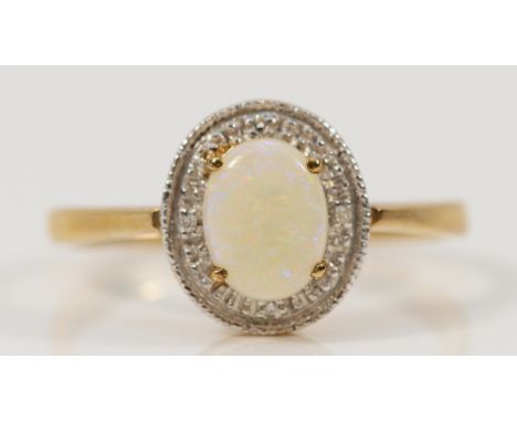 A 9ct gold opal and diamond cluster ring, one diamond setting vacant, R, 2.2g