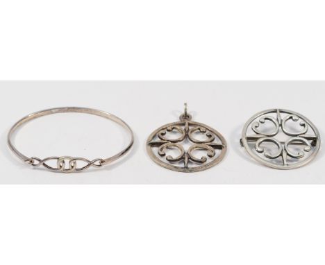 Ola Gorie, a 925 silver circular pendant, 40mm, with a matching brooch, 40mm, and a 925 silver bangle, 60mm, 31g