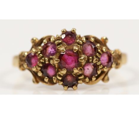 A 9ct gold ruby cluster ring, P, 2g