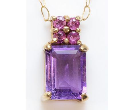 A 9ct gold ruby and amethyst pendant with a chain, 1.6g