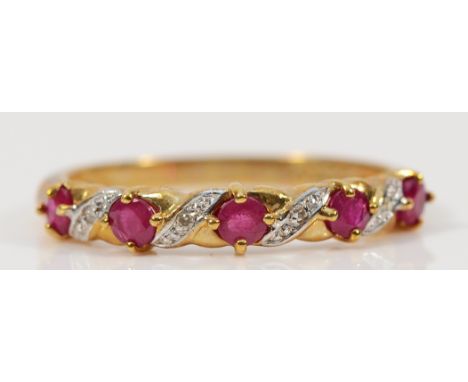 A 9ct gold ruby and diamond dress ring, P, 1.8g