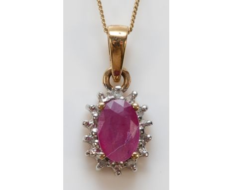 A 9ct gold ruby and diamond cluster pendant with a chain, 1.2g