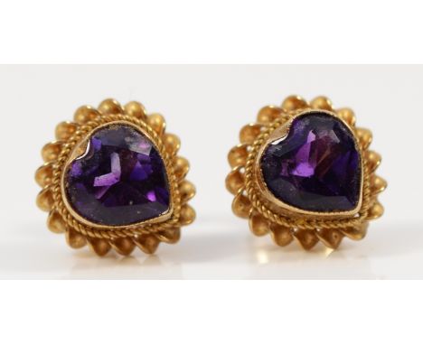 A pair of 9ct gold heart shaped amethyst earrings with scroll backs, 1.6g