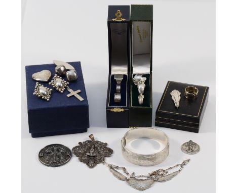 A silver hinged bangle with engraved floral design, 45g, an 835 silver necklace, 10g, three 925 silver pendants and several s