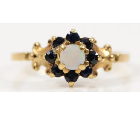 A 9ct gold opal and sapphire cluster ring, K 1/2, 1.9g