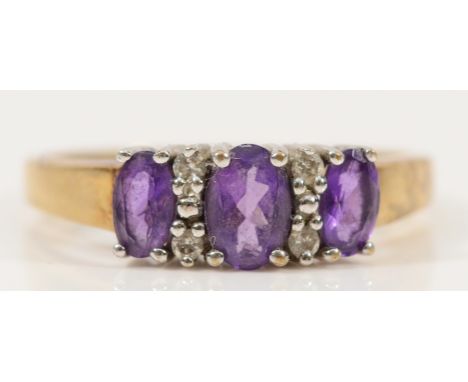 A 9ct gold amethyst and diamond dress ring, O, 2.4g