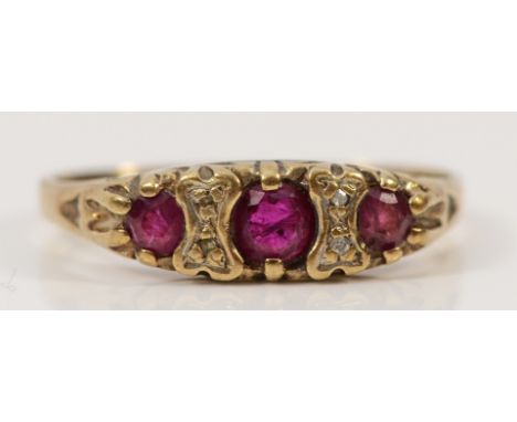 A 9ct gold ruby and diamond dress ring, London 1986, O, 1.7g