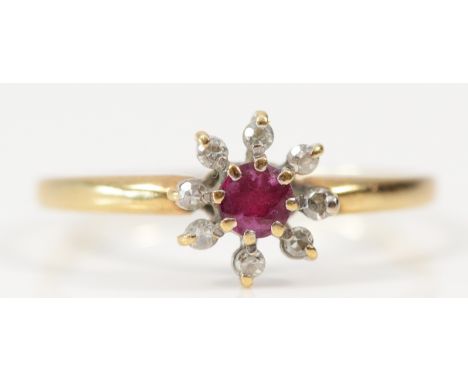 A 9ct gold ruby and single cut diamond floral cluster ring, O, 1.4g