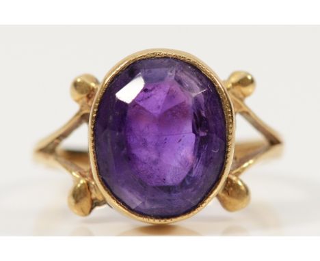 A 9ct gold amethyst cocktail ring with split shoulder detail, Birmingham 1976, 12mm x 10mm amethyst, K, 3.5g