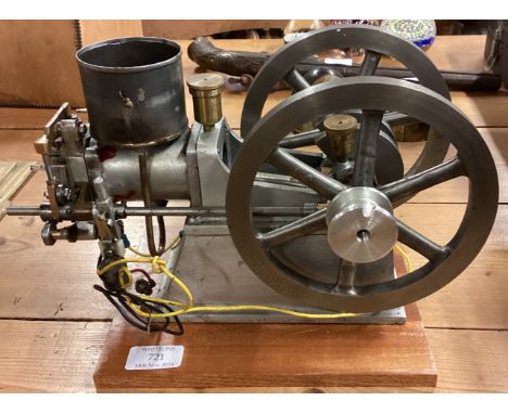 An old aluminium mounted engine. Est. £20 - £30.