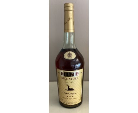 A 100cl bottle of Hine Signature Fine Cognac.