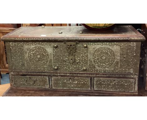 A Continental brass mounted hinged top trunk. Est. £50 - £80.