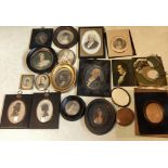 A collection of miniatures and miniature frames.