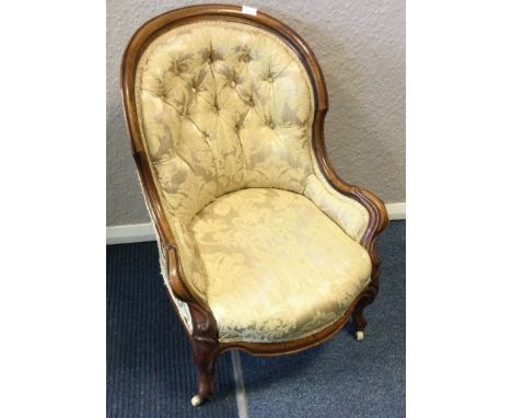 An attractive Victorian button back armchair. Est. £50 - £80.