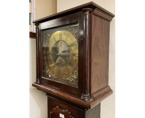A good oak cased grandfather clock with brass dial. Est. £80 - £120.