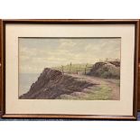CHARLES H BRANSCOMBE: (British, 1858 - 1924): A framed and glazed watercolour of a coastal path.